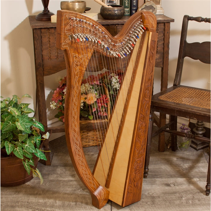 Full shot of front and spruce soundboard. Roosebeck Minstrel Harp, 29 Strings, Sheesham, Chelby Levers. Celtic Thistle carved inlay.