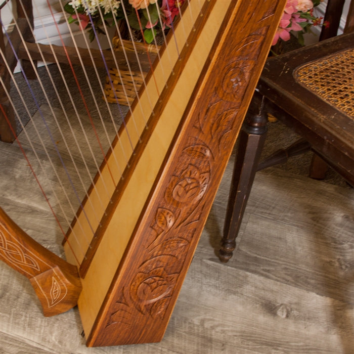 Close-up of Celtic Thistle carved inlay. Roosebeck Minstrel Harp, 29 Strings, Sheesham, Chelby Levers.