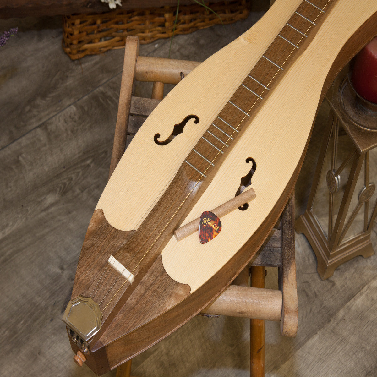 Roosebeck 4 String Grace Mountain Dulcimer, F-scroll sound hole, bottom shot with noter and pick.