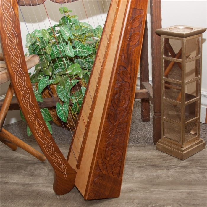 Roosebeck Pixie Harp, 19 Strings, Sheesham, Chelby Levers. Side view of carved Celtic Thistle inlay and soundboard.