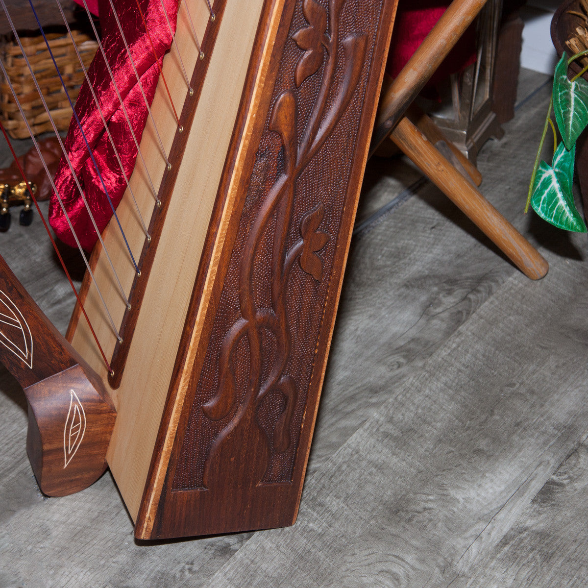 Roosebeck 22 String Heather Harp (Upgrded Chelby Levers, Carved Vine Inlay). Bottom side close-up of carved vine inlay.